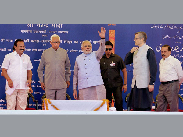 Prime Minister Narendra Modi waves during a ceremony