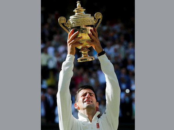 Novak Djokovic of Serbia holds up the trophy Novak Djokovic of Serbia holds up the trophy