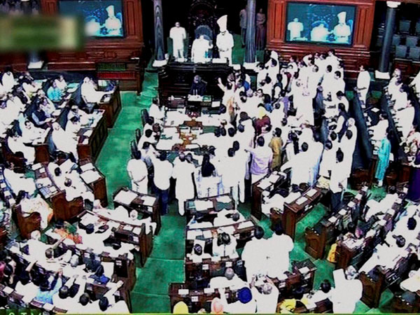 Opposition members raise slogans in the well of the Lok Sabha Opposition members raise slogans in the well of the Lok Sabha