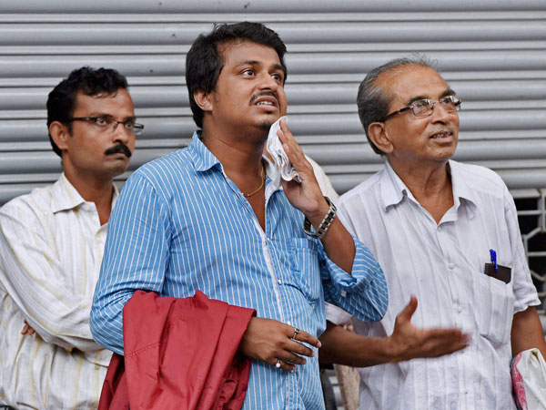 Investors look at the screen outside BSE as the sensex Investors look at the screen outside BSE as the sensex