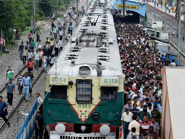 Hundreds of passengers arrive by a local train
