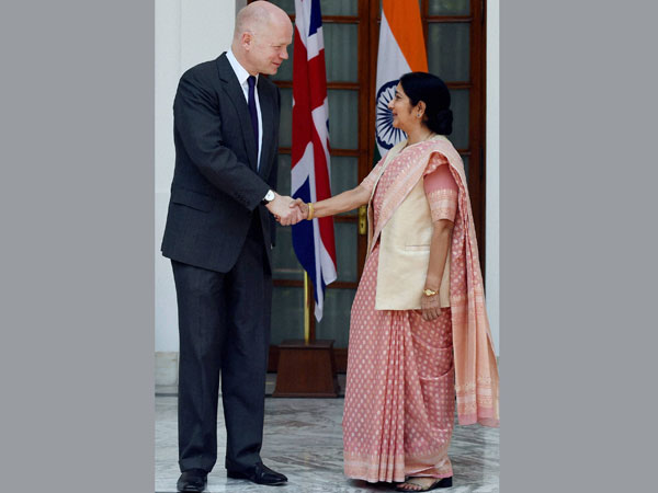 External Affairs Minister Sushma Swaraj shakes hands