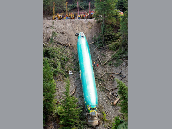 A work crew pulls a Boeing 737 fuselage up