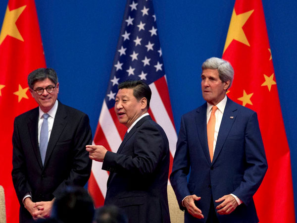 Chinese President Xi Jinping, center, shares a light moment with U.S. Secretary