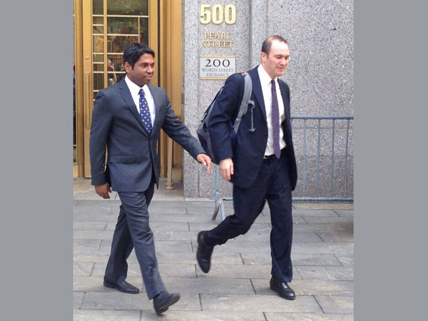 Rengan Rajaratnam, left, exits Manhattan federal court in New York