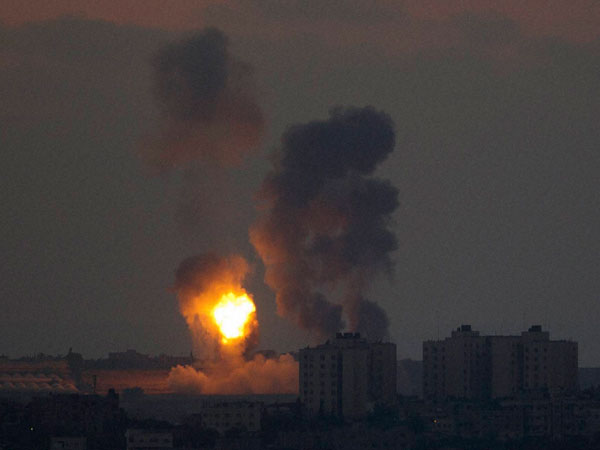 Smoke and fire rise following an Israeli strike on Gaza