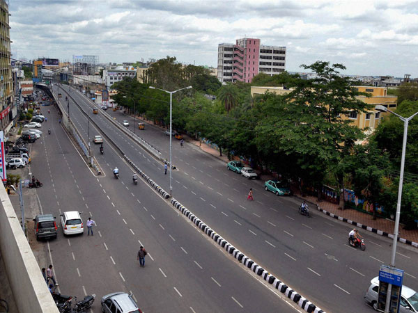 Passenger waits for the buses which were off the roads
