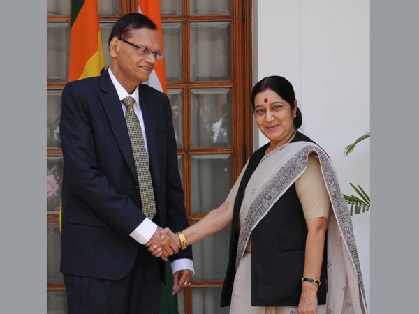 External Affairs Minister Sushma Swaraj shakes hands with her Sri Lankan counterpart