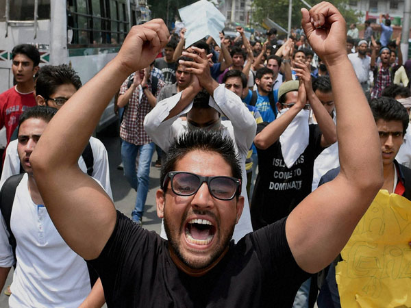 Students shout slogans during a protest Students shout slogans during a protest