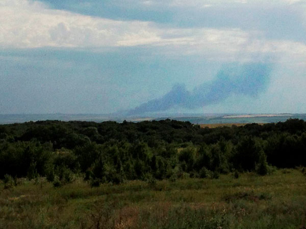Smoke rises from where a Malaysia Airlines