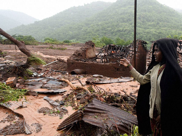 Relative of a landslide victim at Malin village in Pune
