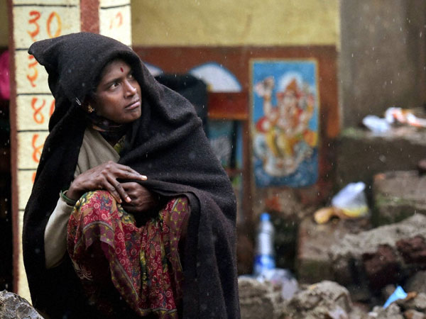 Relative of a victims at the site of a landslide in Malin village in Pune