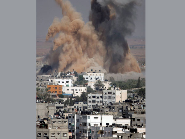 Smoke and sand from an explosion rise after an Israeli strike