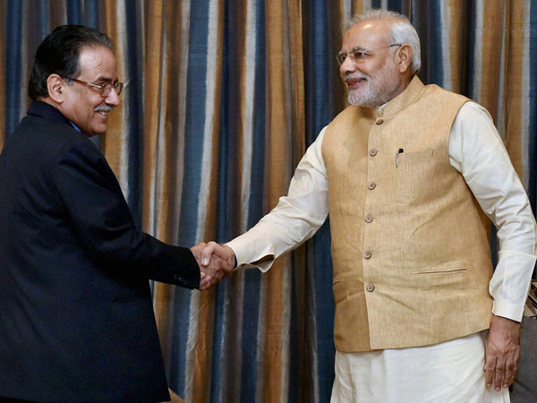 PM Narendra Modi shakes hands with Chairman of UCPN
