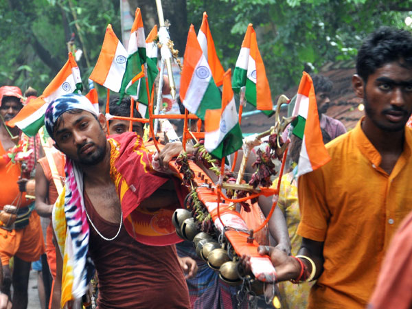 Kanwariyas (worshippers of lord Shiva) proceed towards Tarakeswar Temple
