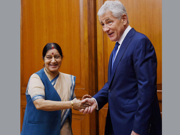 Sushma Swaraj shakes hand with US Secretary of Defence Chuck Hagel Sushma Swaraj shakes hand with US Secretary of Defence Chuck Hagel
