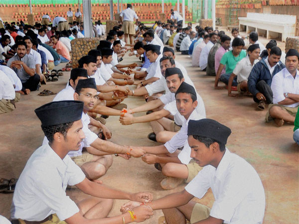 RSS members trying rakhi on each others wrist