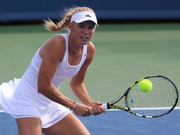 Caroline returns a volley 