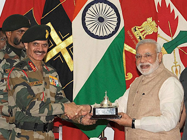 General Dalbir Singh presenting a memento to PM Narendra Modi