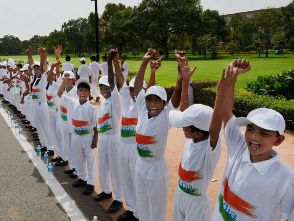 School children making a human chain for peace & harmony