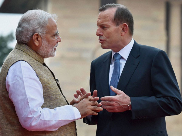 PM Modi talks with his Australian counterpart