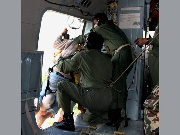 Jammu and Kashmir Chief Minister Omar Abdullah drops relief packets 