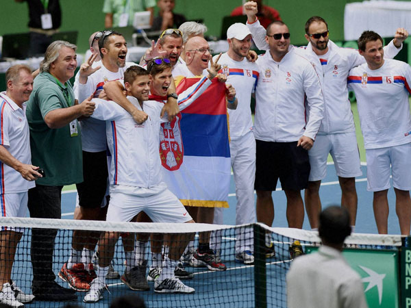 Serbian players celebrate after Filip Krajinovic defeated