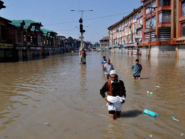 People walk with their folded lowers