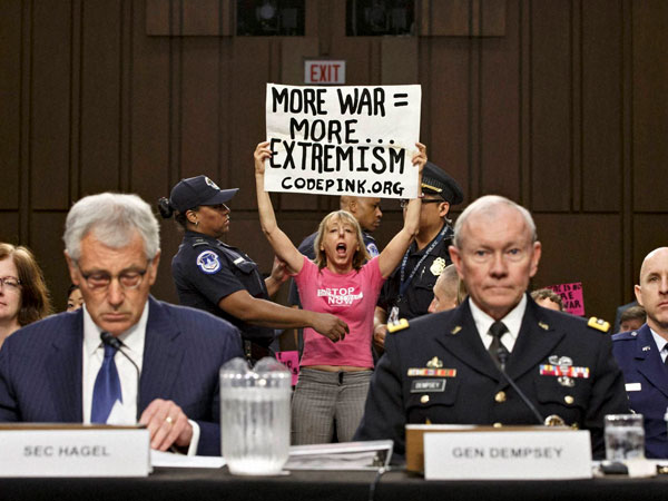 Anti-war activist disrupt hearing 