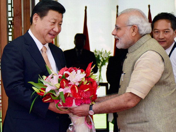 Prime Minister Narendra Modi greets Chinese President