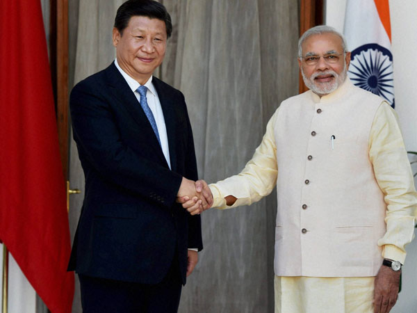 Prime Minister Narendra Modi shakes hands with Chinese President