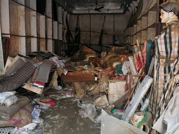 A shop in ruins after the flood water receded