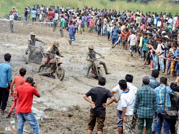 People watch the bikers as they participate