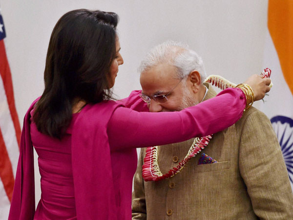 Prime Minister Narendra Modi greeted with a garland
