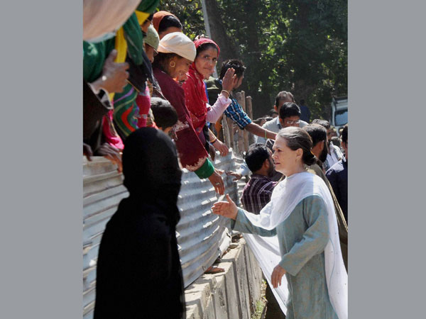 Congress President Sonia Gandhi interacting with flood victims