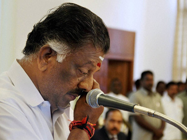 AIADMK leader O Panneerselvam in a sombre mood at Raj Bhavan