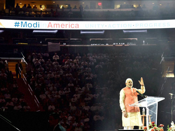 Prime Minister Narendra Modi gestures while addressing the audience