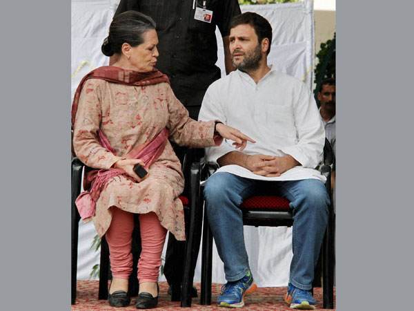 Congress President Sonia Gandhi talks to party Vice President Rahul Gandhi