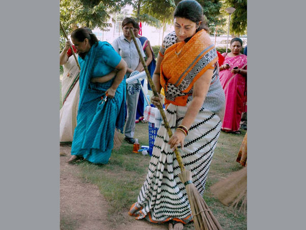 Union Human Resource Development Minister Smriti Irani sweeps the ground
