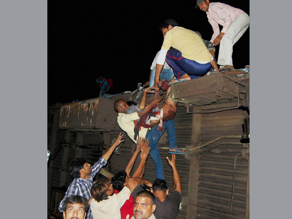People rescuing an injured passenger 