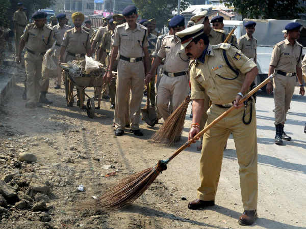 Police Force personnel sweeps the roadsides