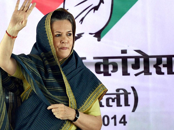 Congress President Sonia Gandhi waves at an election rally