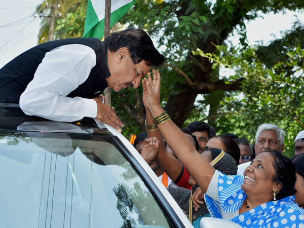 Former Maharashtra CM Prithviraj Chavan being welcomed by a woman