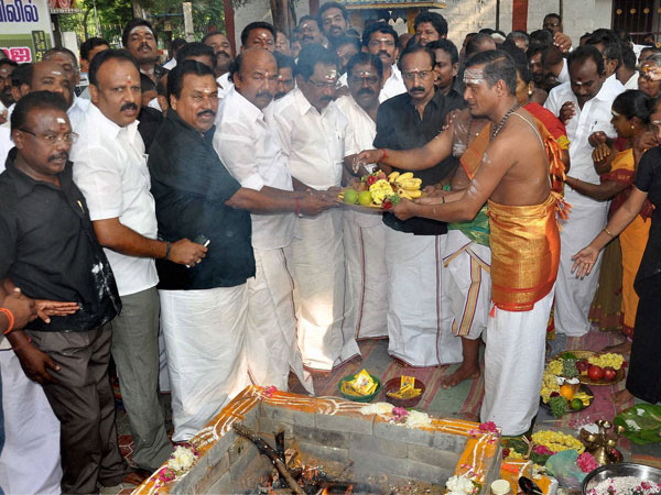 AIADMK members perform a puja at Murugan Temple