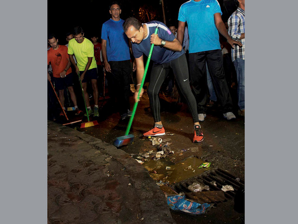 Industrialist Anil Ambani participates in a clean drive Industrialist Anil Ambani participates in a clean drive