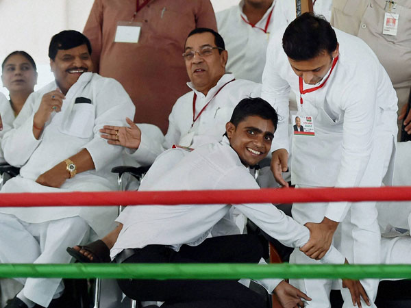 A supporter seeks blessings of Uttar Pradesh Chief Minister Akhilesh Yadav