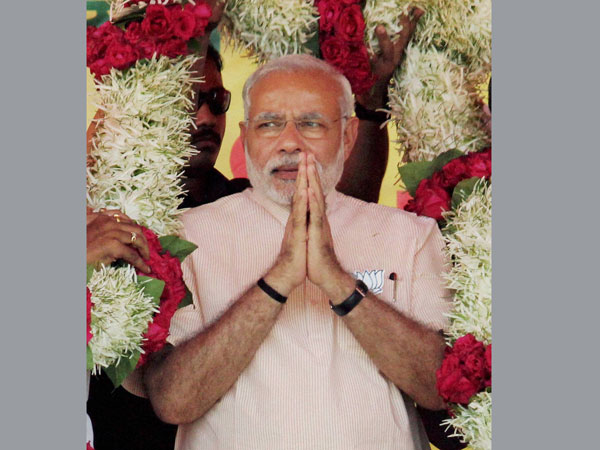 Prime Minister Narendra Modi being garlanded