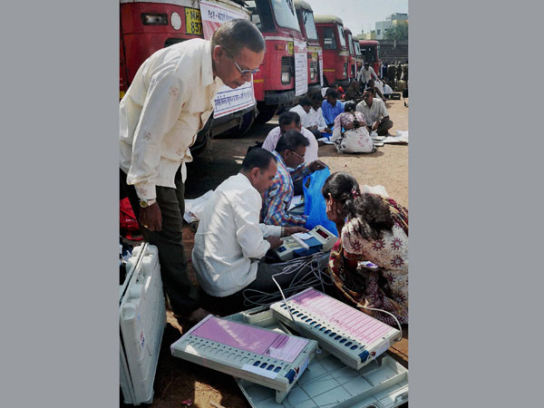 Polling officials while checking Electronic Voting Machines 