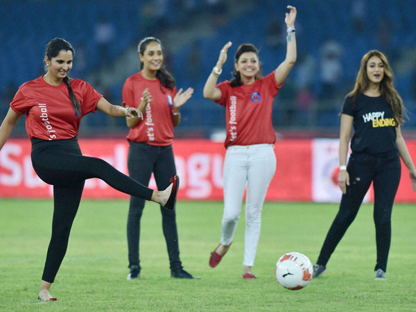 Tennis Star Sania Mirza kicks a football during the ISL 2014 match
