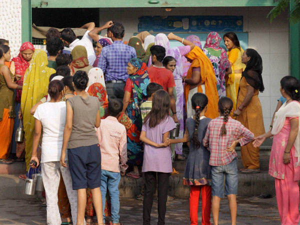 People buying milk as the curfew was relaxed People buying milk as the curfew was relaxed